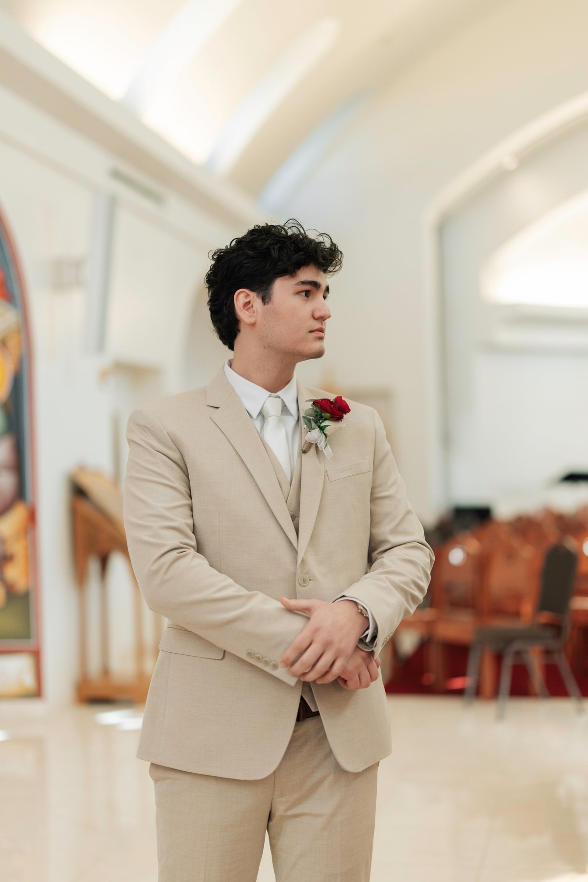 The groom waits in the nave before the wedding ceremony