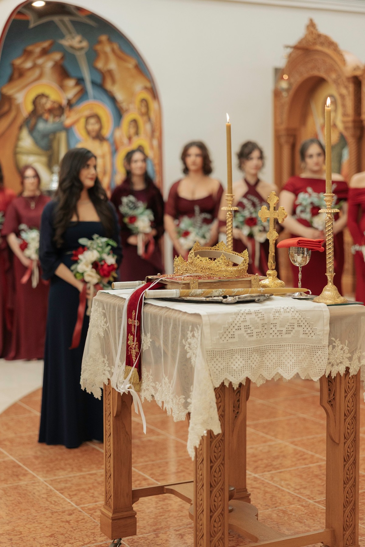 Wedding crowns and candles on the tetrapod beside the choir