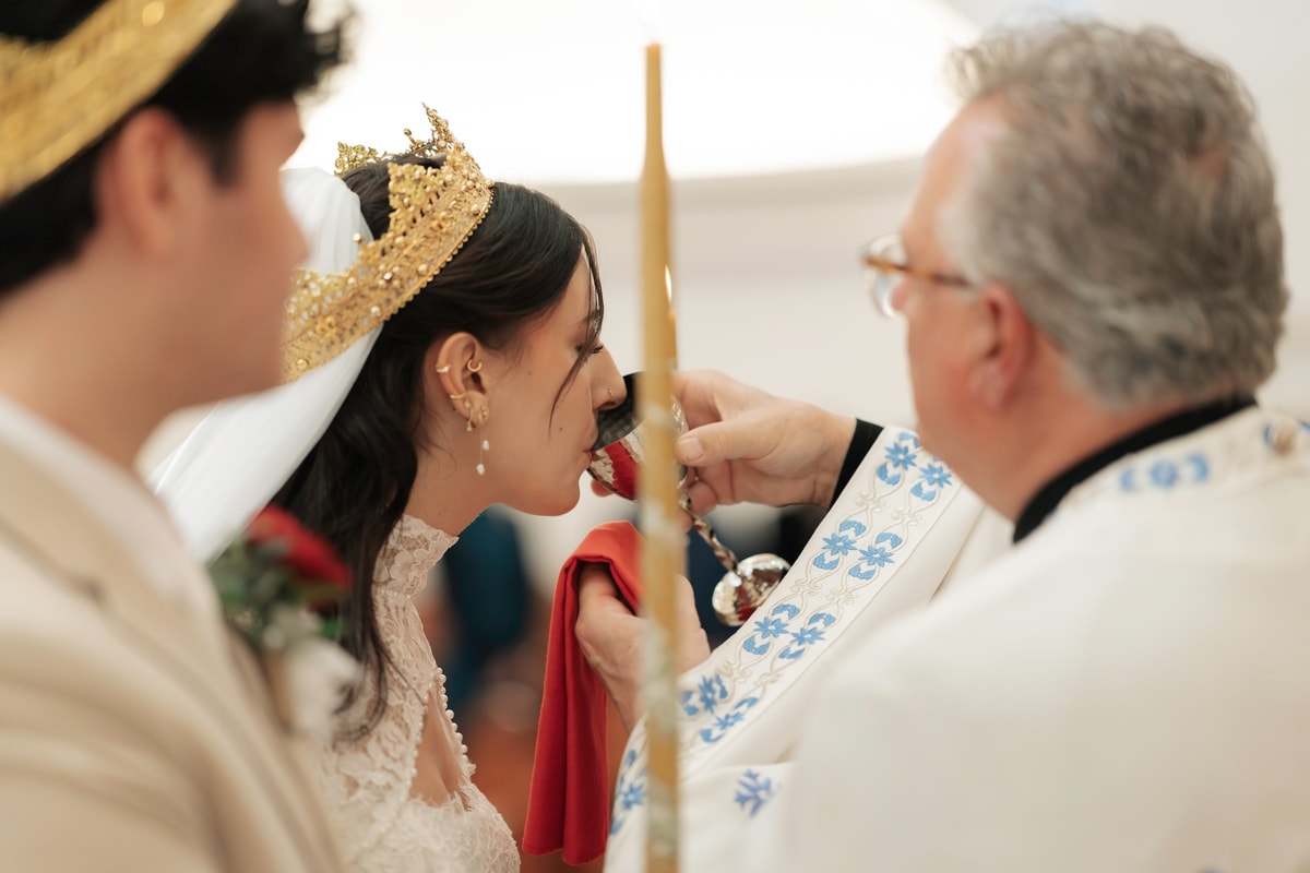 The bride drinks from the common cup