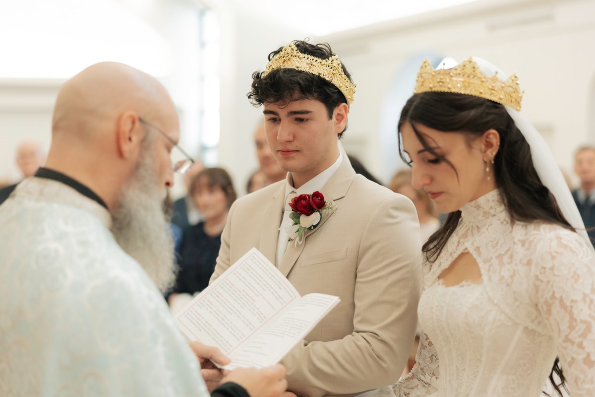 A priest gives the newly married couple their final blessing