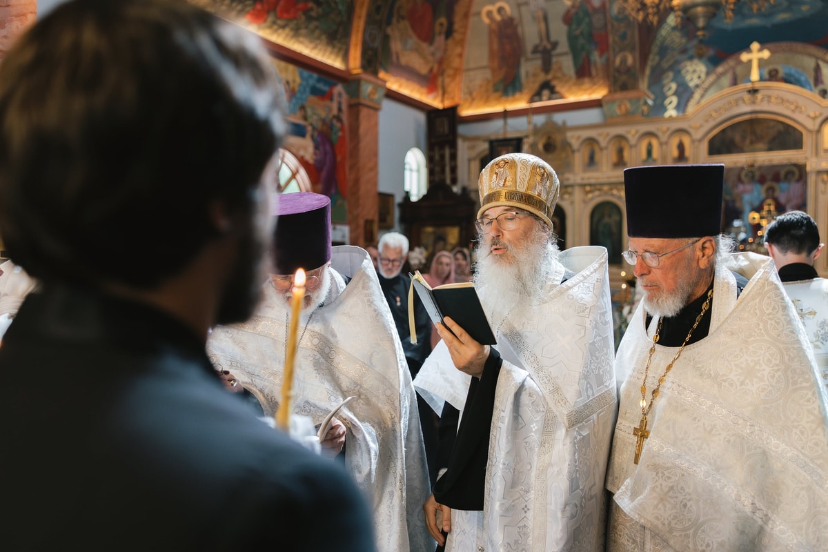 Orthodox clergy process into the church