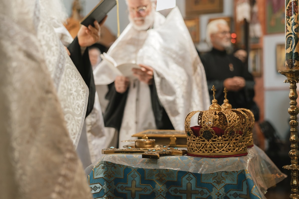 Ornate Orthodox wedding crowns arranged on the service table