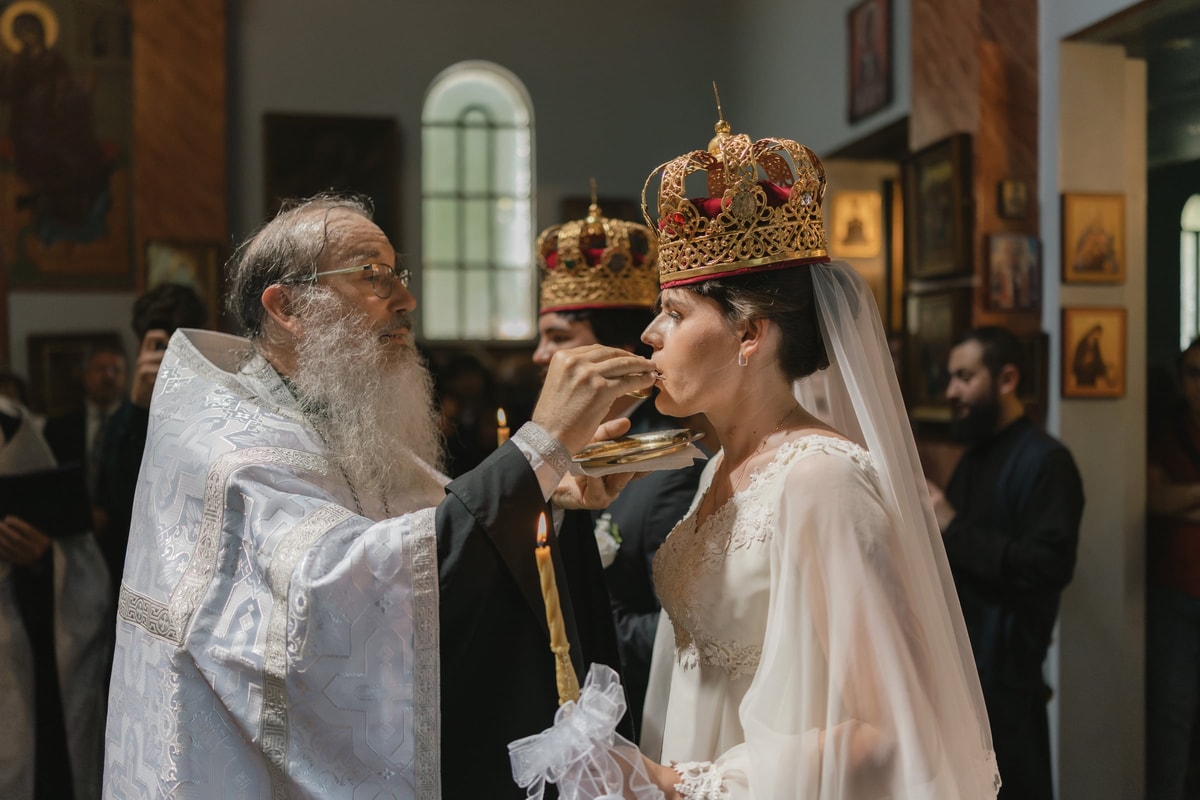 The bride drinks from the common cup