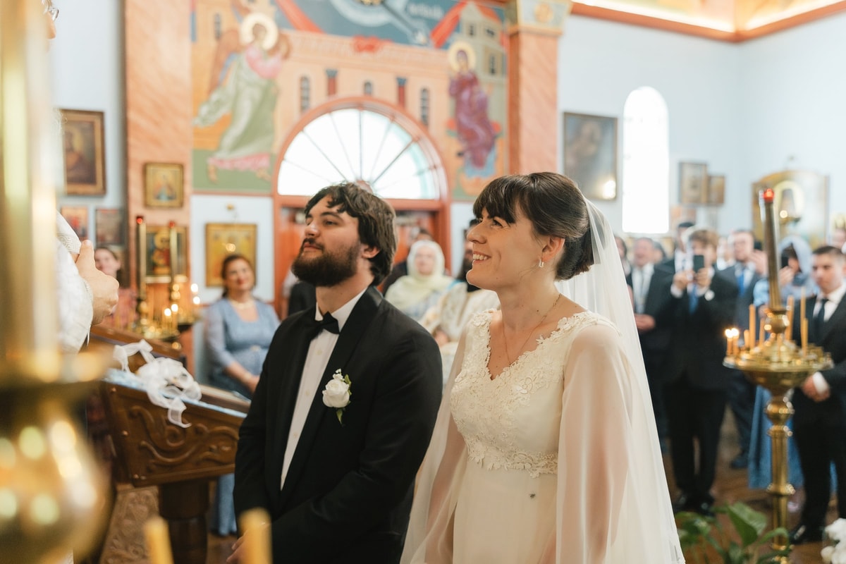 The bride and groom stand together at the end of the service