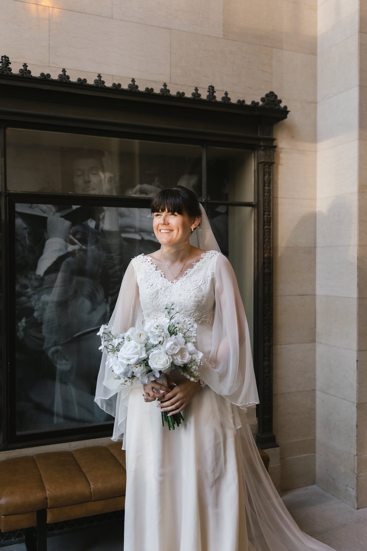 The bride holds her bouquet for a bridal portrait