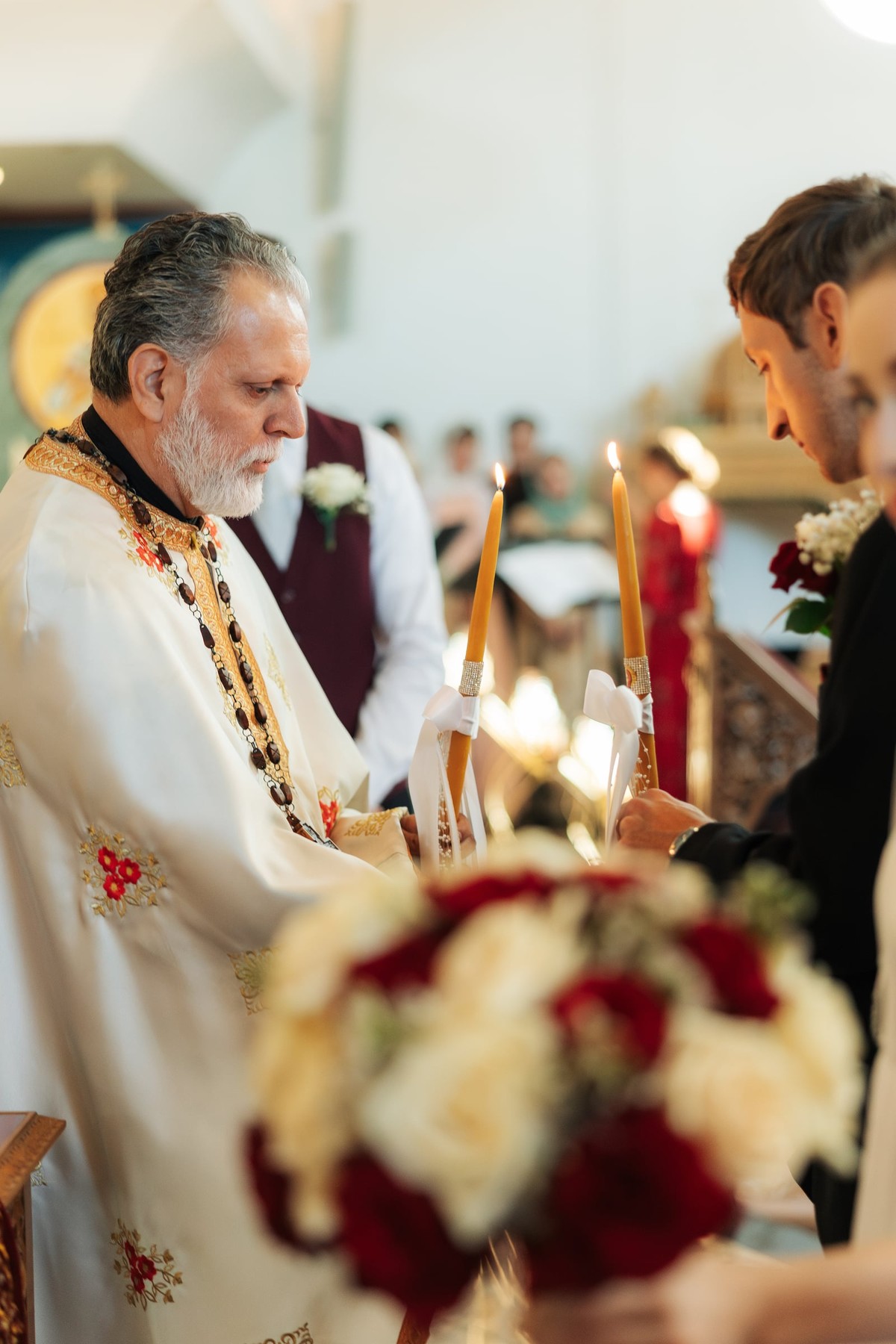 A priest stands at the tetrapod before the iconostasis