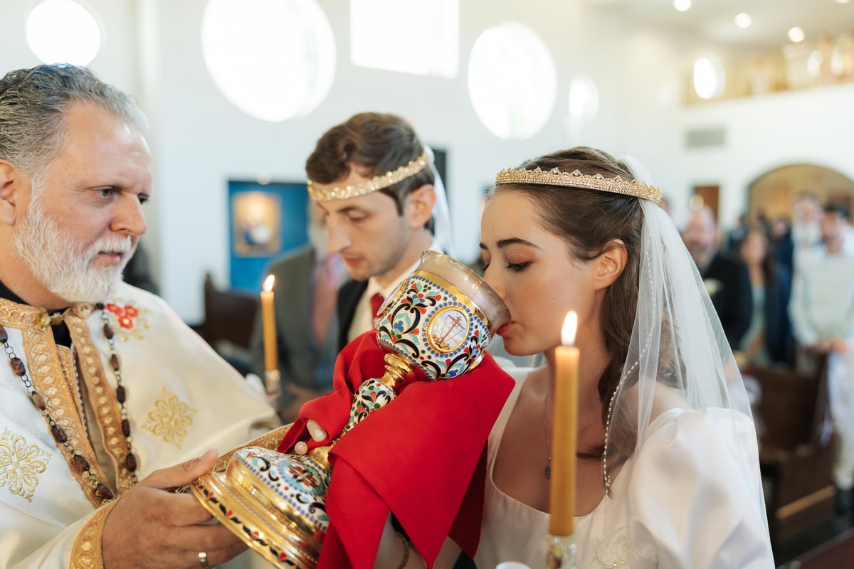 The bride drinks from the common cup