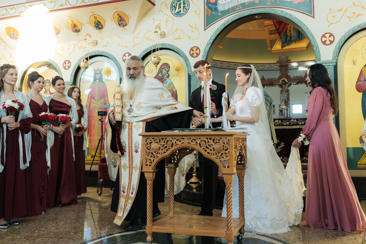 A reader chants beside the choir during the wedding service