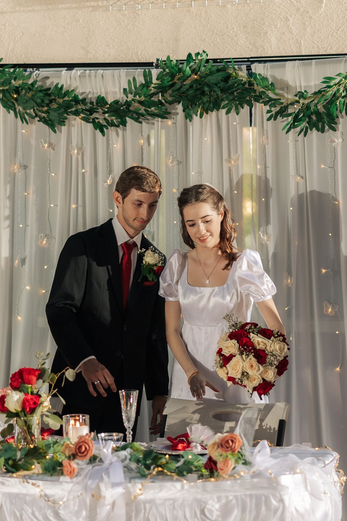 The bride and groom cut their wedding cake