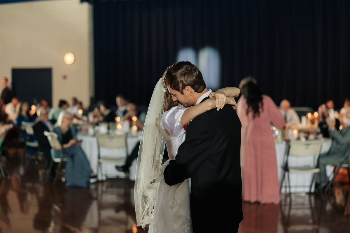 The bride and groom share their first dance