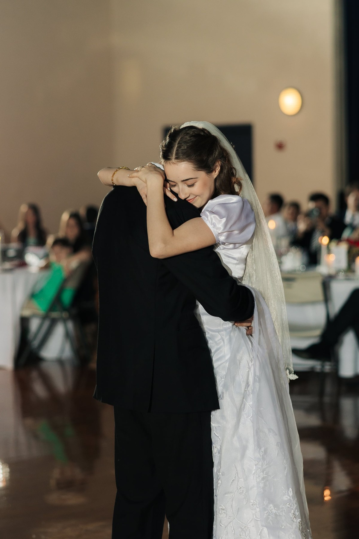 The bride and groom share their first dance