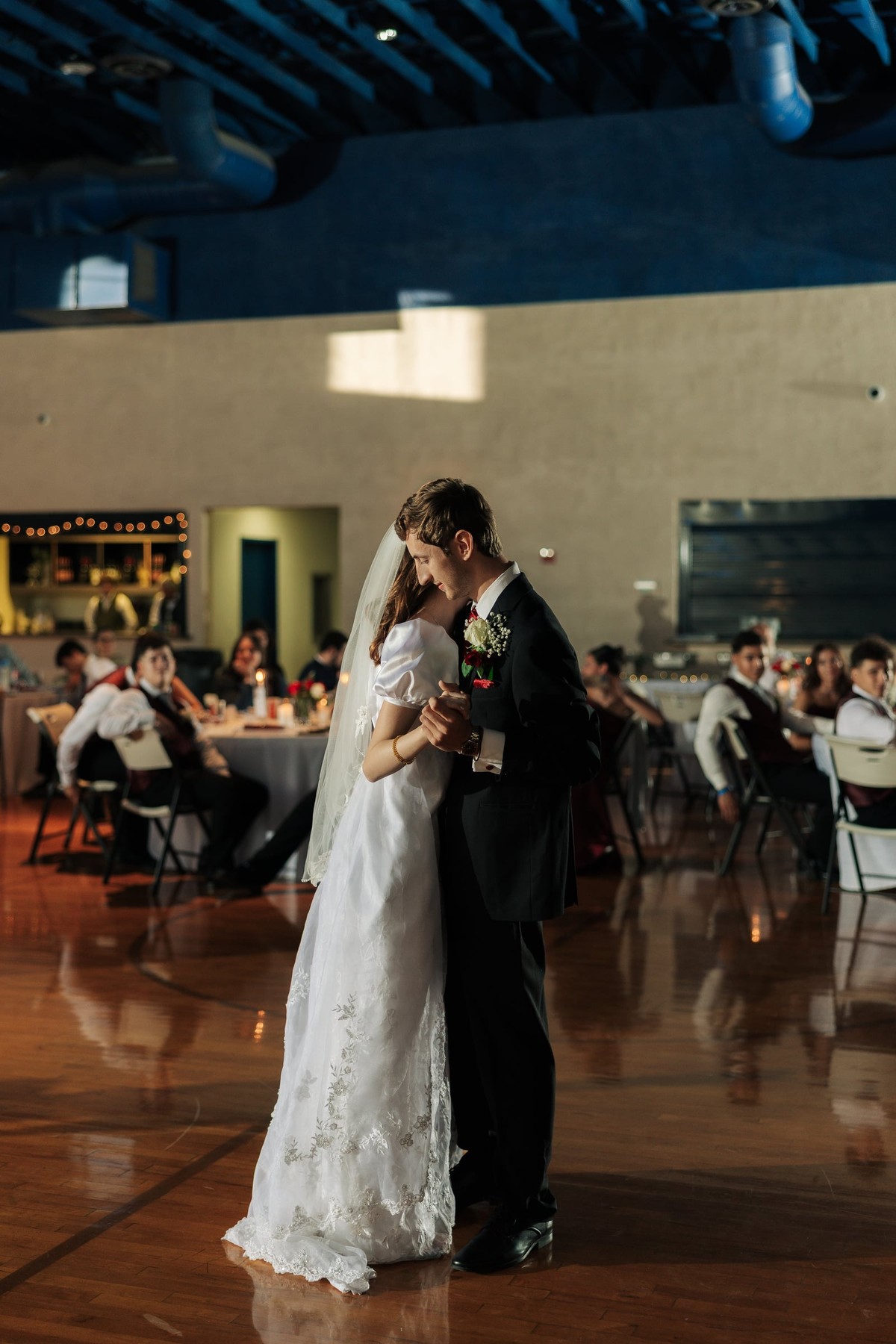 The bride and groom share their first dance