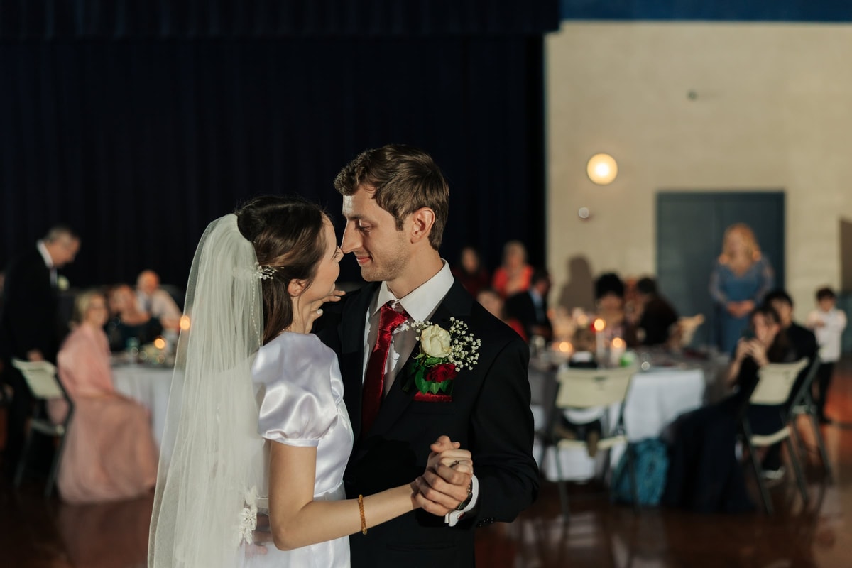 The bride and groom dance together at their reception