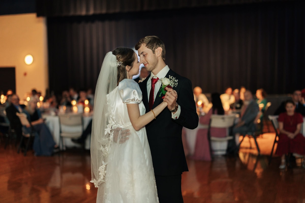 The bride and groom dance together at their reception