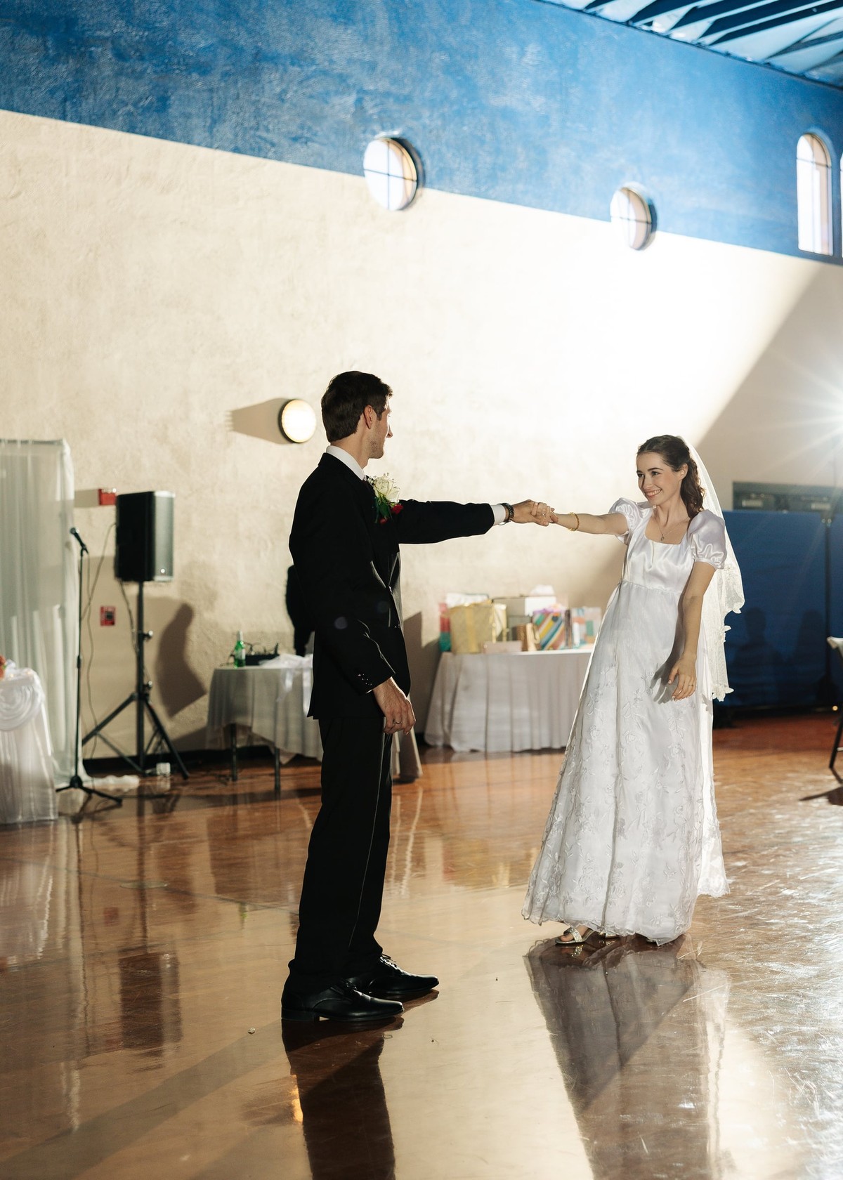 The bride and groom dance together at their reception