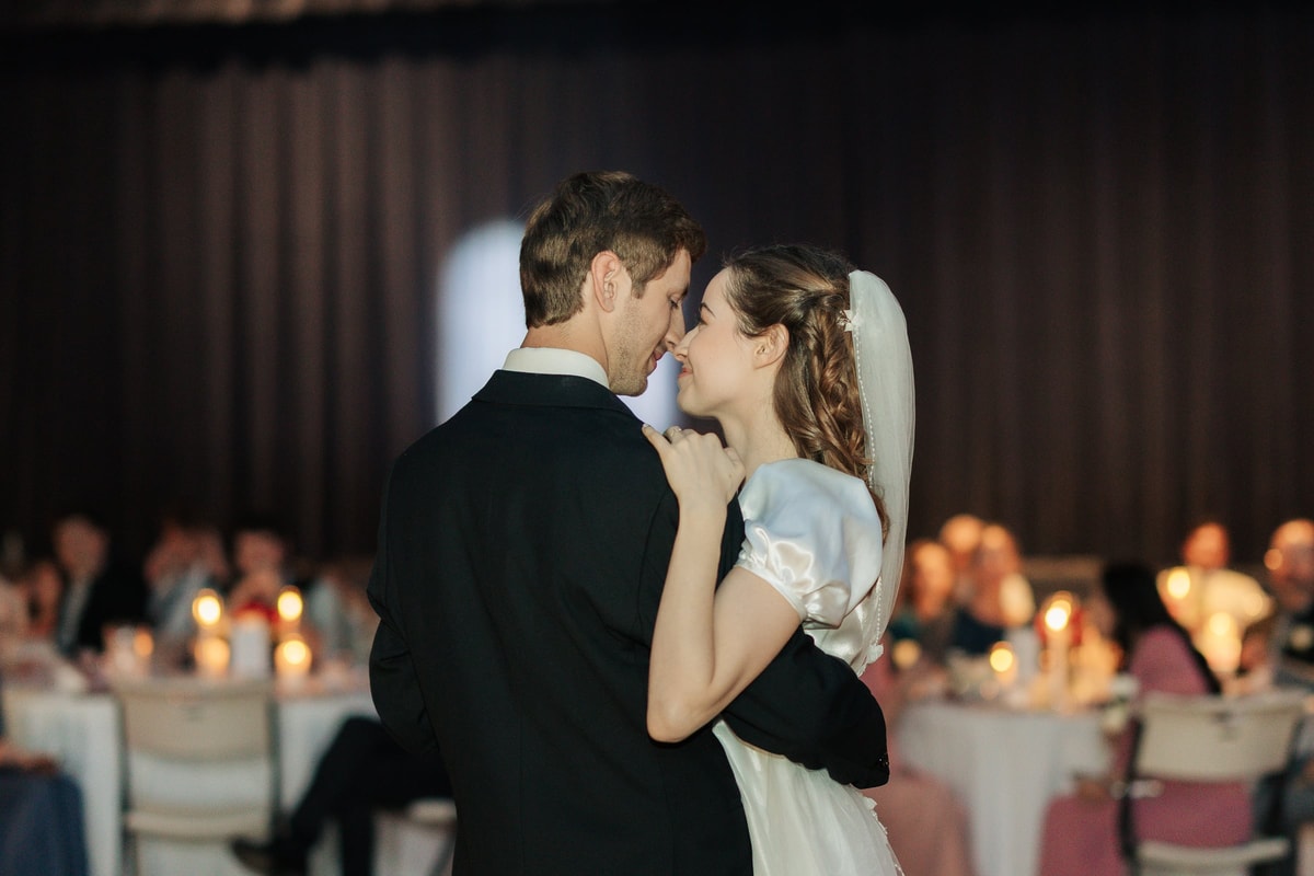The bride and groom dance together at their reception