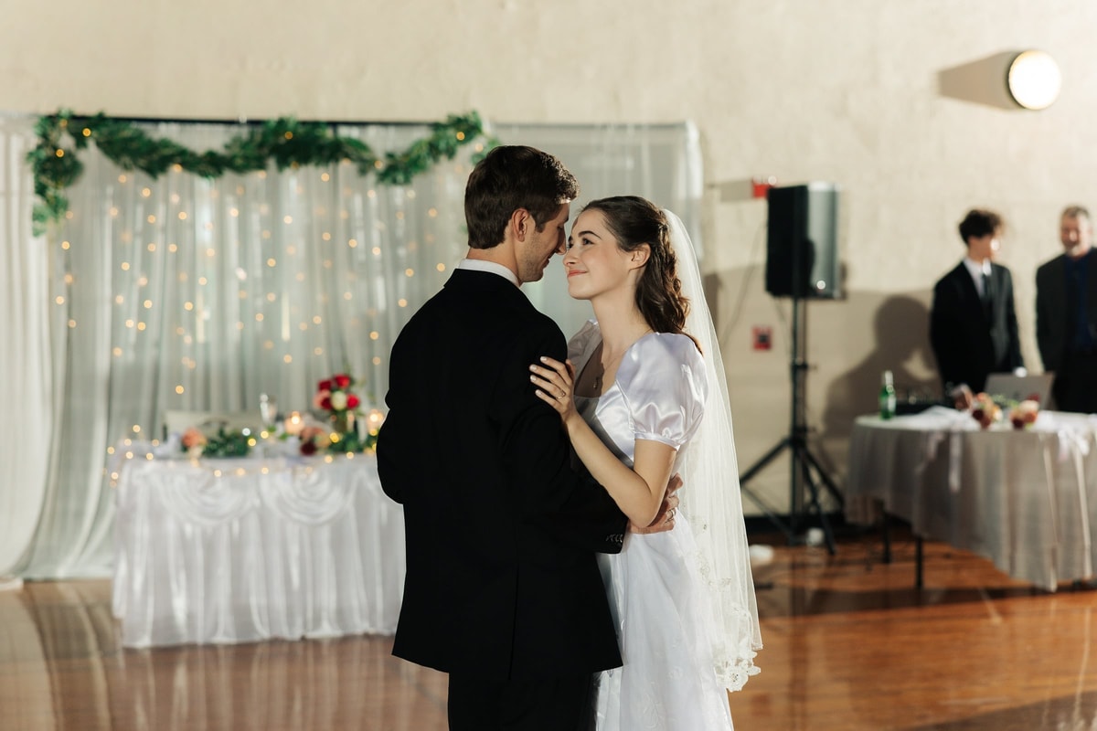 The bride and groom dance together at their reception