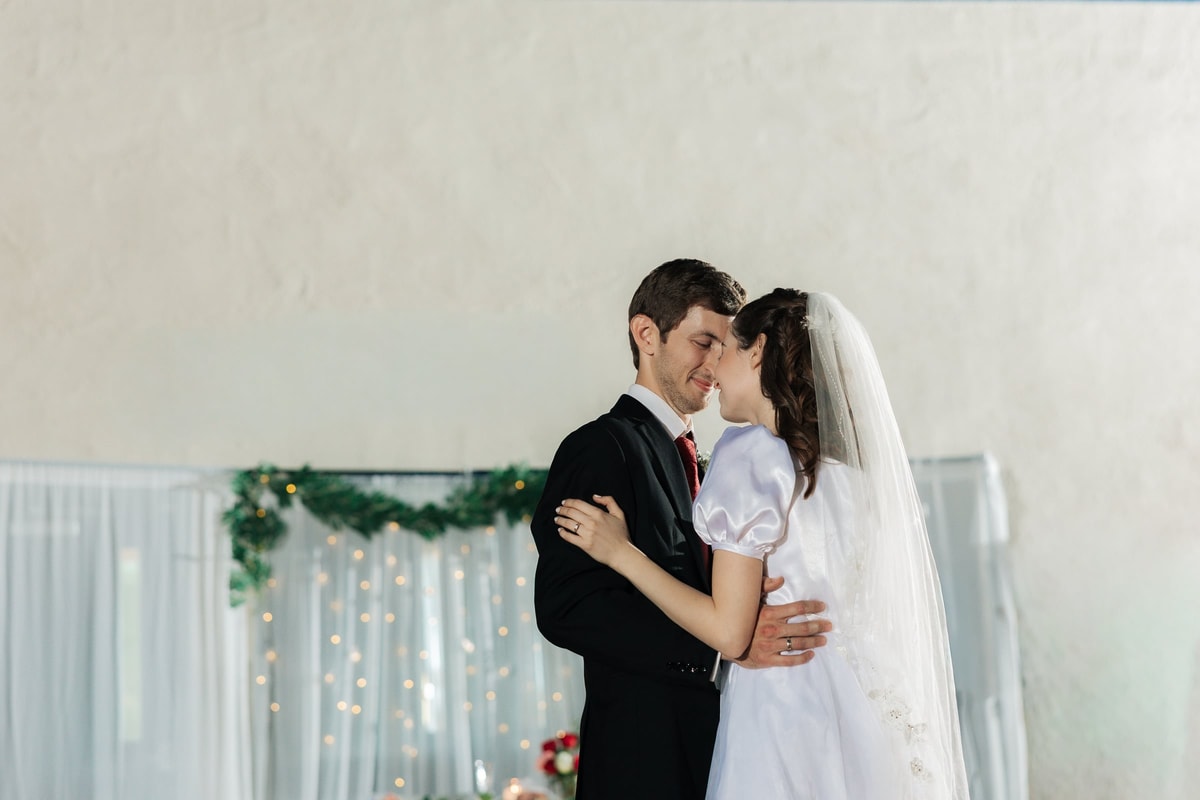The bride and groom dance together at their reception