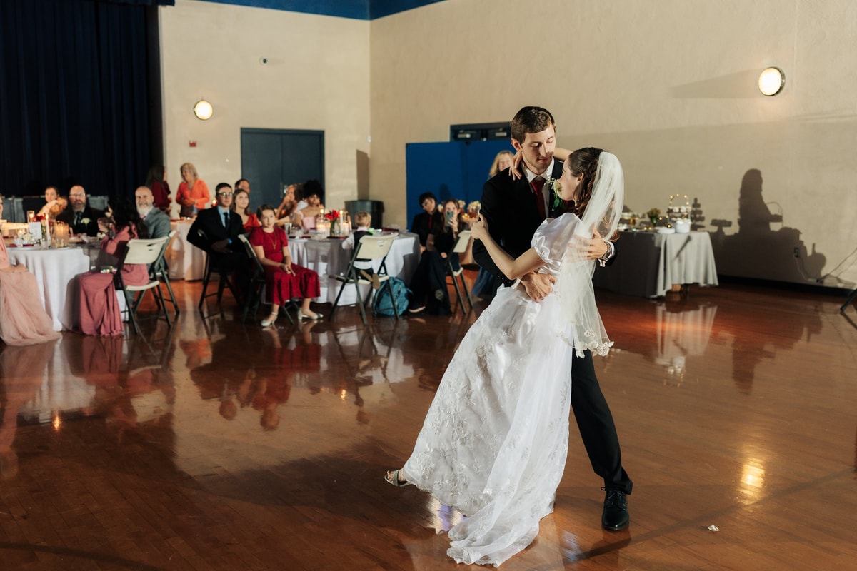The bride and groom dance together at their reception